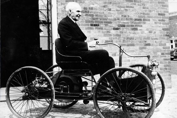 Henry Ford sitting in car