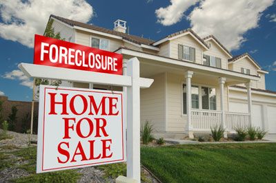 Foreclosure sign with house
