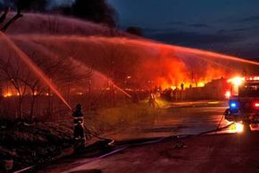 Firefighters battle a brush fire 