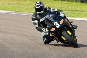 Motorcyclist racing in full gear