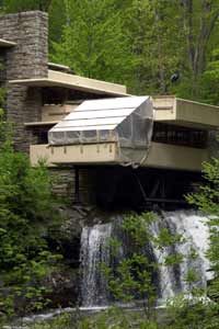 A picture of Fallingwater undergoing restoration in order to preserve the home.