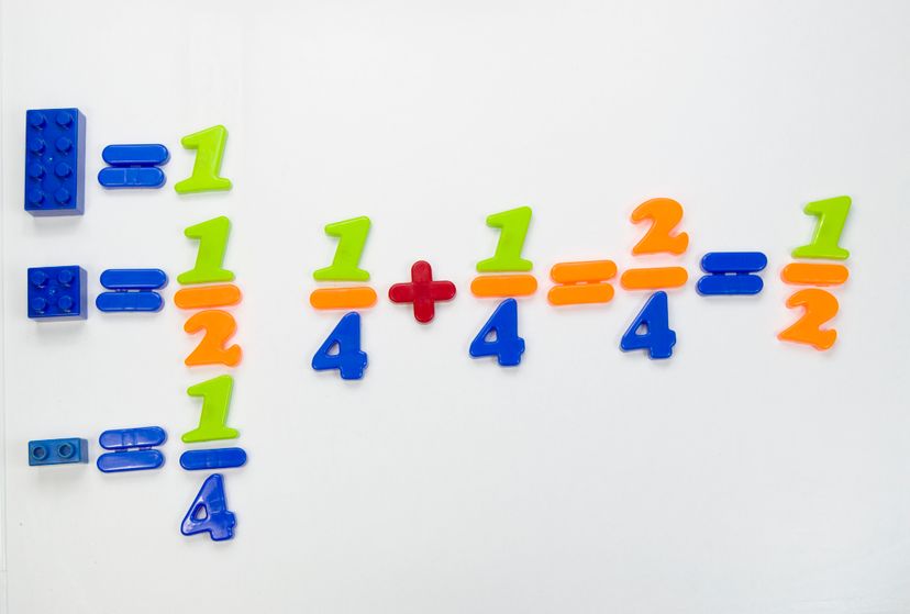 Multi color plastic blocks and magnetic numbers of plastic to teach basic math