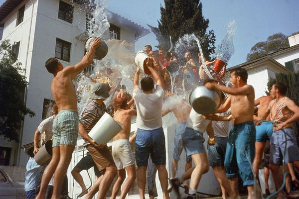 A group of fraternity brothers in a waterfight.