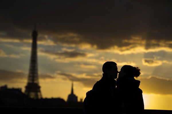 Romantic silhouettes back lit by a stunning sunset.