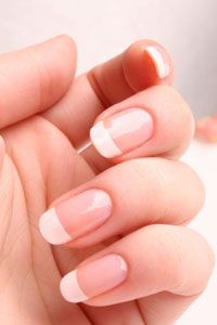 A French manicure has to be perfect to look right -- no bumps, wavy lines or steaks.