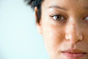 Close up of woman with freckles.