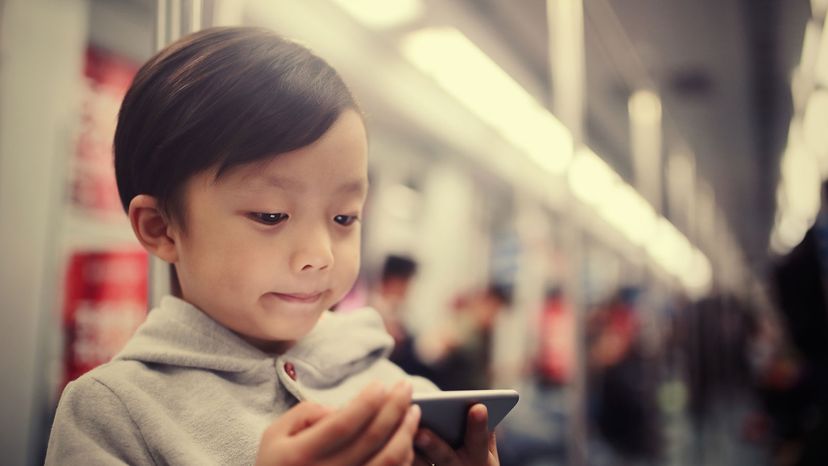 Asian boy on subway