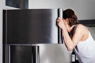 Man looking into freezer