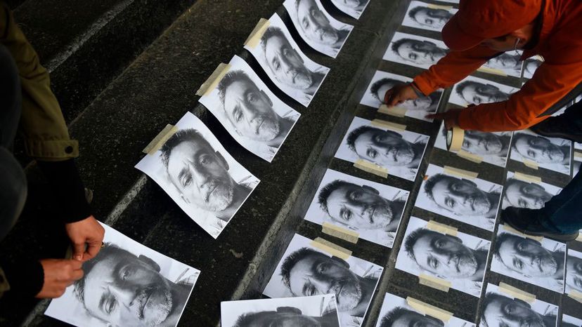 Journalists arrange pictures of Candido Rios during a demonstration demanding justice at the headquarters of the Ministry of the Interior in Mexico City on Aug. 24, 2017. At the time Rios was the 10th journalist murdered in Mexico for the year. PEDRO PARDO/AFP/Getty Images