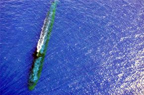 The Los Angeles Class Attack submarine USS Chicago (SSN 721) completes a training maneuver off the coast of Malaysia in July 2001. Kind of makes you realizes how friction could be a very formidable force for a beast like that.