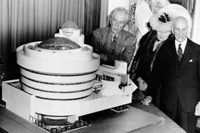 Architect Frank Lloyd Wright, left, looks over his spiral-shaped building for a proposed Guggenheim Museum with arts patron Solomon R. Guggenheim, right, and artist Baroneness Hilla Rebay, director of the proposed museum, on Sept. 20, 1945.