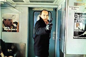 Tony Lo Bianco points a gun on a subway in a scene from the 1971 film 'The French Connection.'  The movie was shot guerilla-style all over New York.
