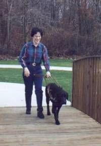 A Guiding Eyes for the Blind graduate with her guide dog