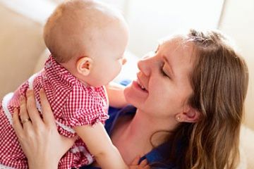 Woman holding baby girl