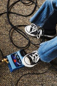 An array of pedals can turn the clean and sometimes thin sound of an electric guitar into something wild and distorted.