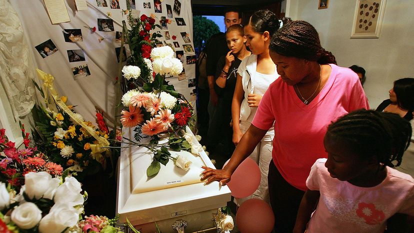 baby casket, mourners