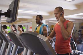 man making call on treadmill