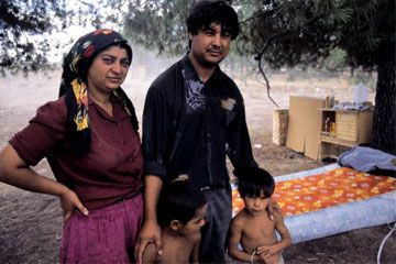 Family outdoors, adult and child, joy and happiness.