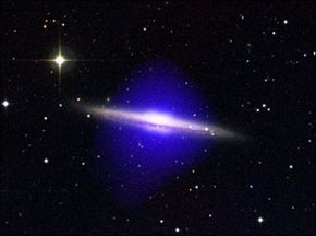 The Chandra X-ray observatory detected a halo of hot blue gas around galaxy NGC 5746. See more pictures of space dust.
