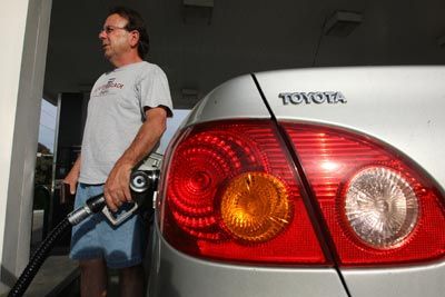 man pumps gas