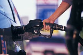 Man pumping gas into car