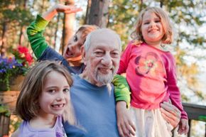 Man playing with young children.