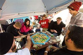 A group of campers play &quot;Settlers of Catan&quot; as they wait for a grand opening of a Chick-Fil-A in California in 2011.