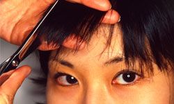 woman having bangs cut