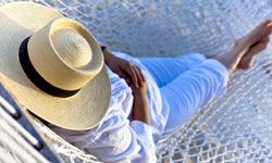 person relaxing in a hammock