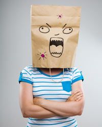 person with a paper bag over their head