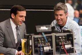 Steve Carell and Peter Segal review a scene.