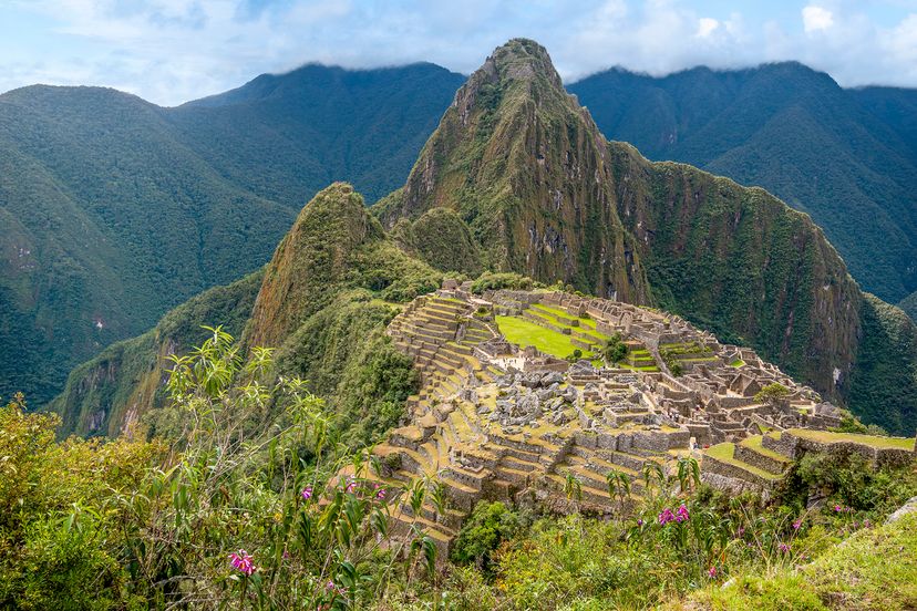 Ancient ruins amid green mountain peaks