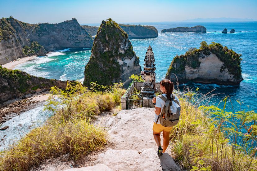 Tourist looking at Diamond beach from above, Nusa Penida, Indonesia