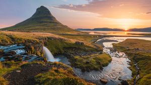 Sunset landscape view of a small mountain and river in Iceland