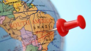 Pushpin pointing to Brasilia in a globe