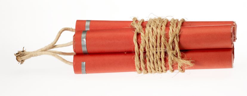 A crude bundle of three sticks of dynamite bound with twin