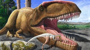 Small dinosaur leaning into a giant dinosaur's open mouth