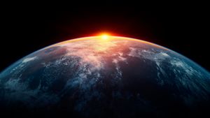 curvature of earth with sun behind and black space around