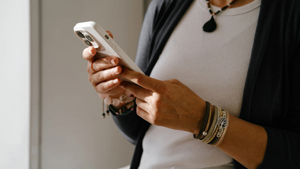 Woman in home clothes with mobile phone