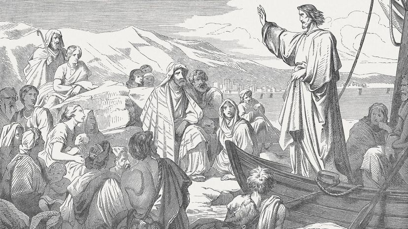 Black and white illustration of Jesus standing on a boat, speaking to a dozen people