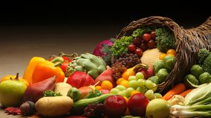 Cornucopia basket overflowing with fresh fall produce