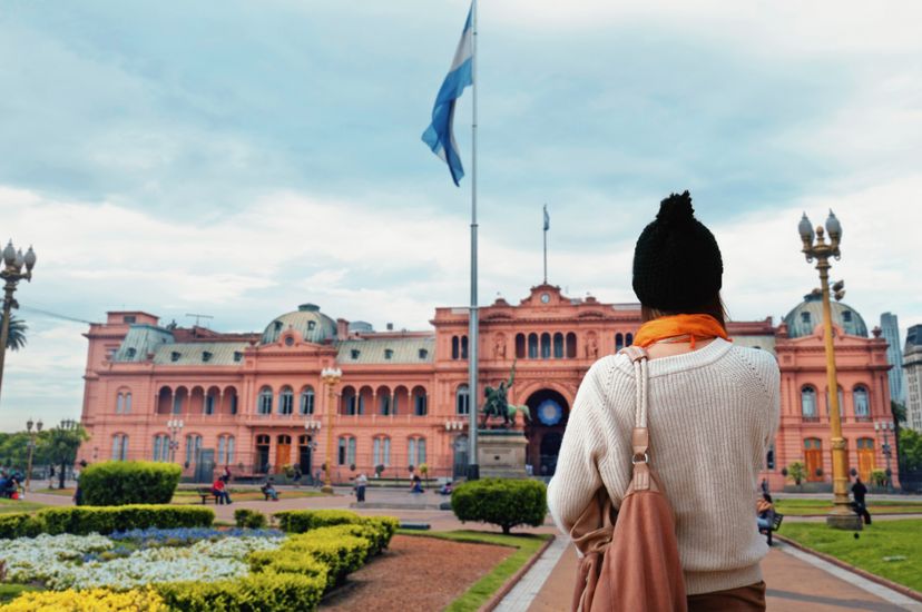 Young Woman walking at Plaza de Mayo Square in Buenos Aires, Argentina