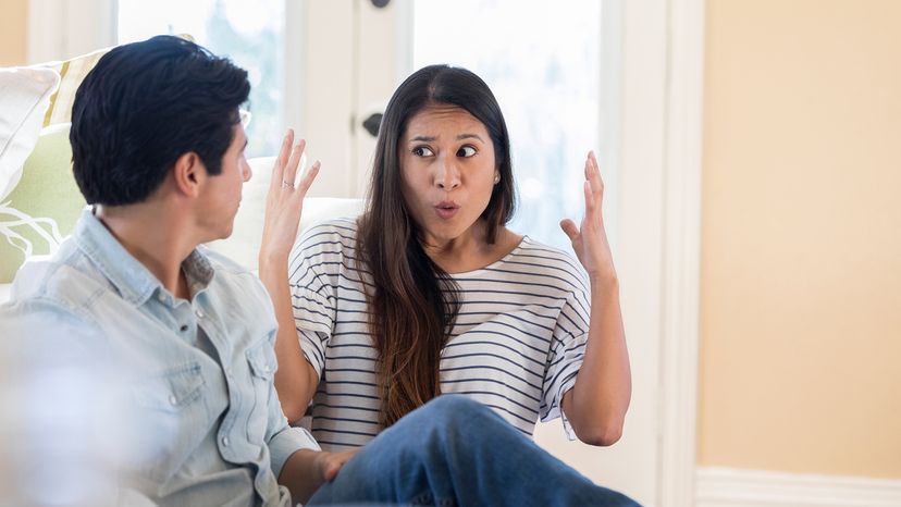 Woman getting frustrated while speaking with a man