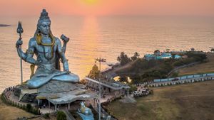 Temple to Shiva at seaside during sunset
