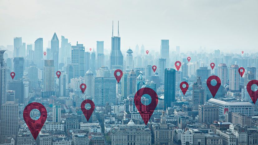 Digital composite image of map pin icons on cityscape of Shanghai