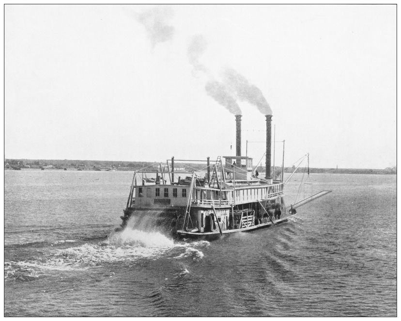 Black and white photo of a steamship sailing away
