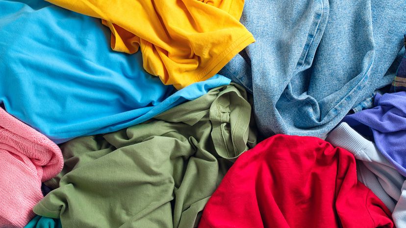 Lots of bright, colorful clothes bunched together