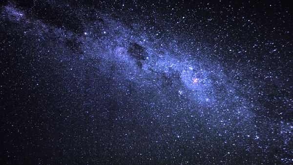 Dark sky with Milky Way dotted in bright stars