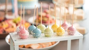 Pastel-colored cake pops decorated with sprinkles