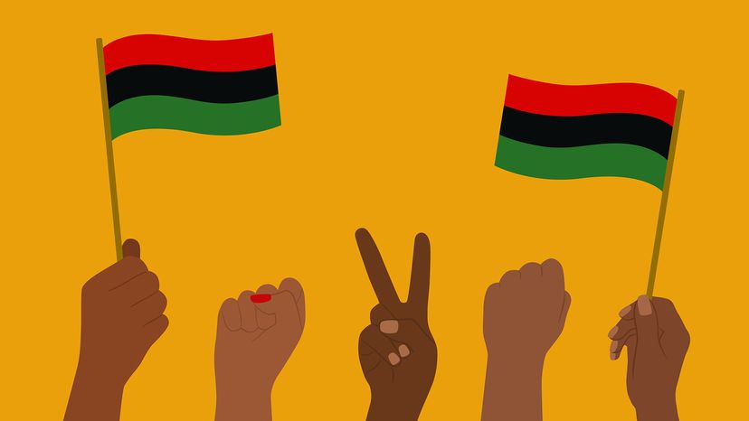 Hands Waving Pan-African Flag And Raised Fists